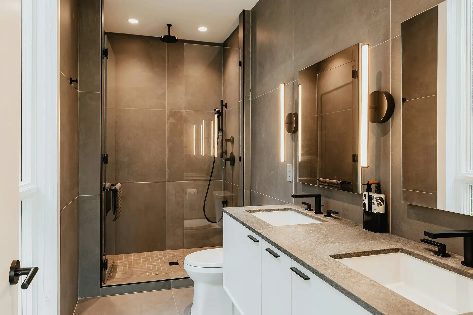 Spa-inspired bathroom renovation in Toronto with walk-in shower and heated floors